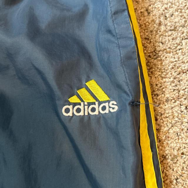 Vintage adidas track pants in a blue/yellow color