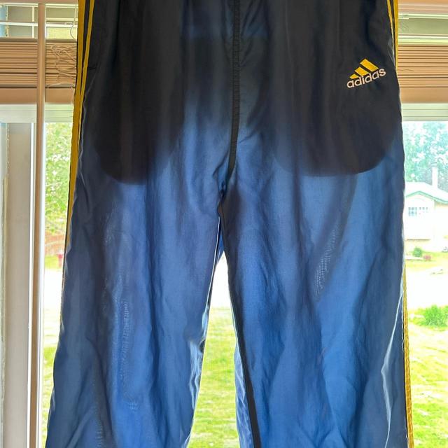 Vintage adidas track pants in a blue/yellow color - Depop