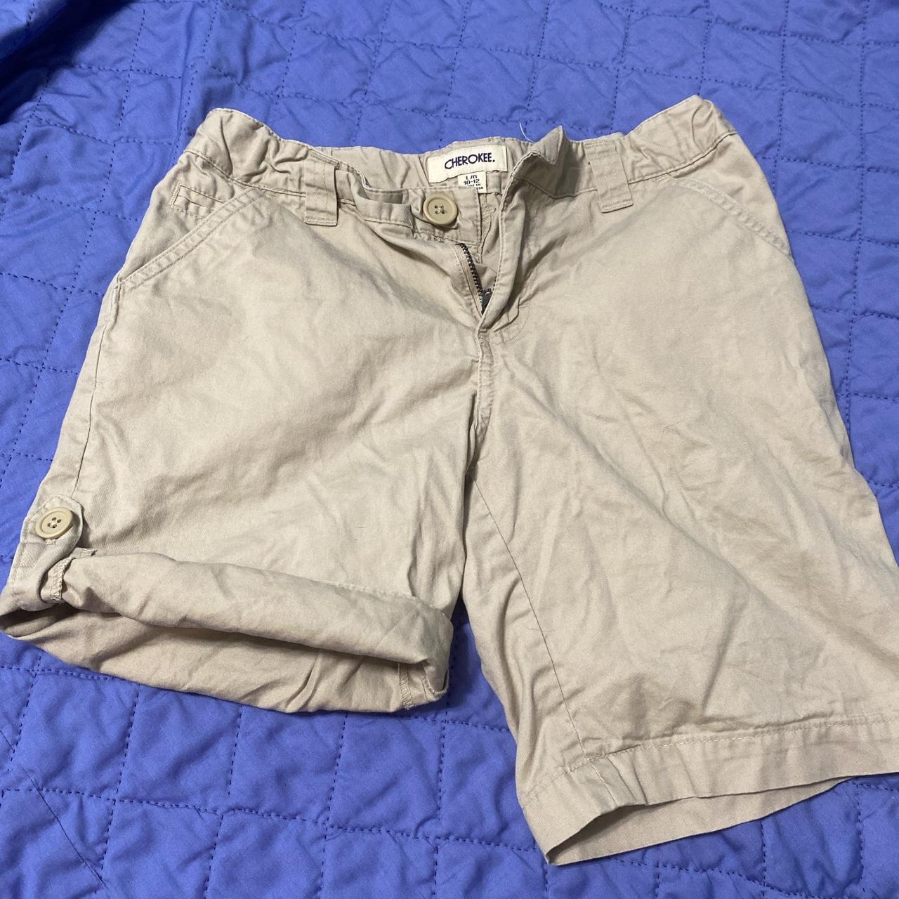 Khaki girls shorts. Can be worn buttoned on side or... Depop