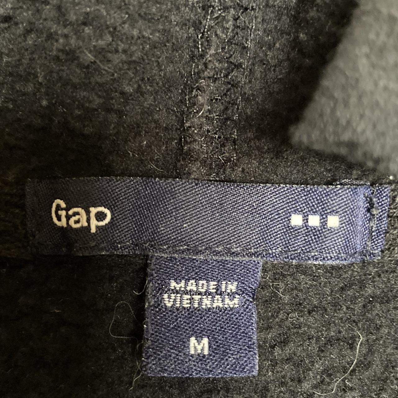 GAP black hoodie with cut on collar size: medium... - Depop