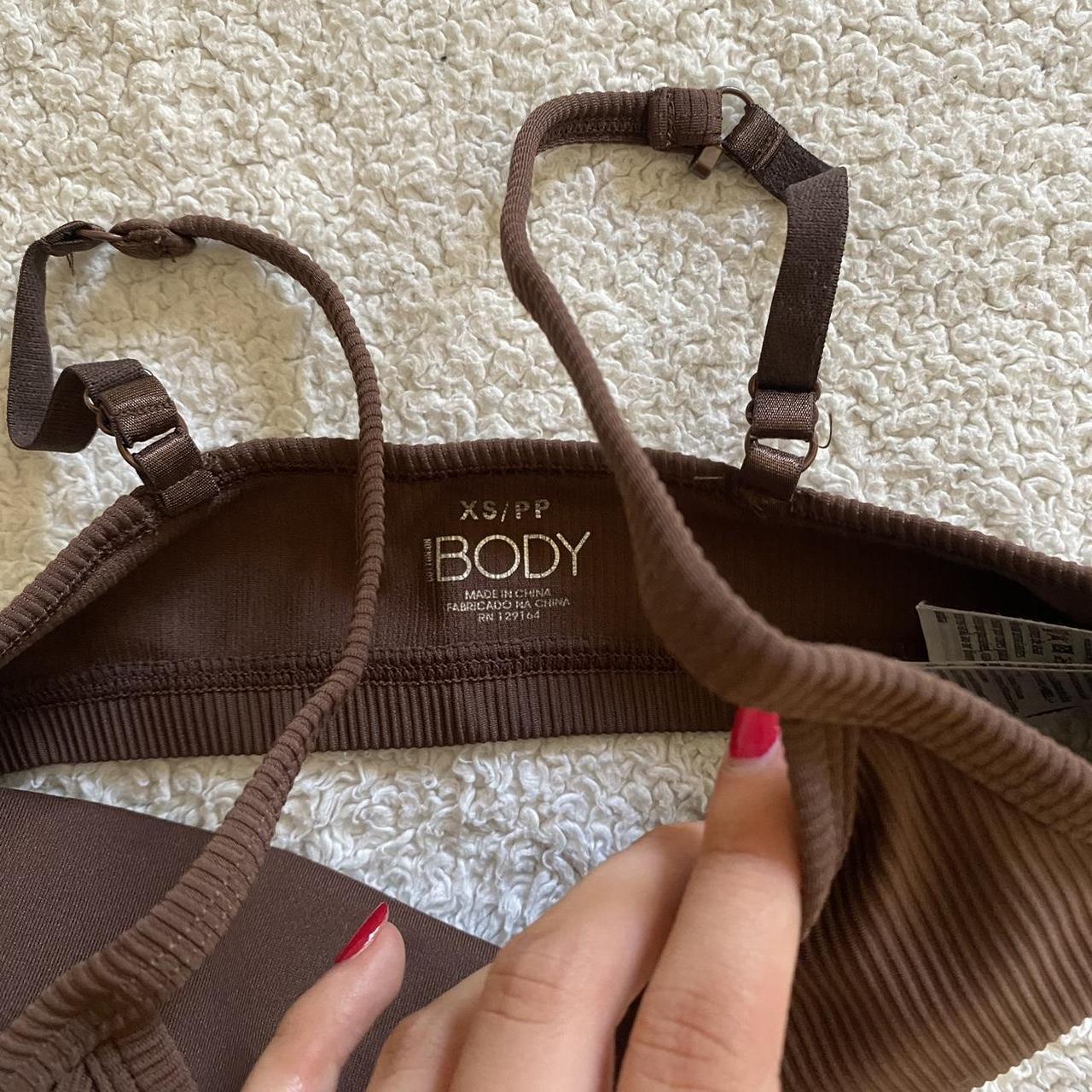 Brown Sports Bra from CottonOn Body, size extra small - Depop