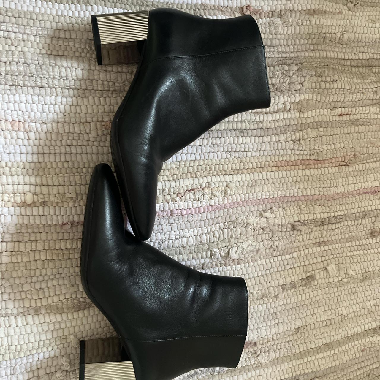 Michael Kors a black leather boot with silver. Depop