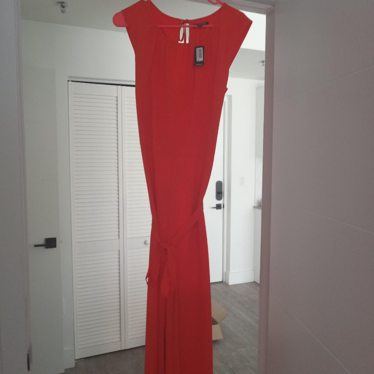 An orange jumpsuit. Very stylish. Limited brand.... - Depop