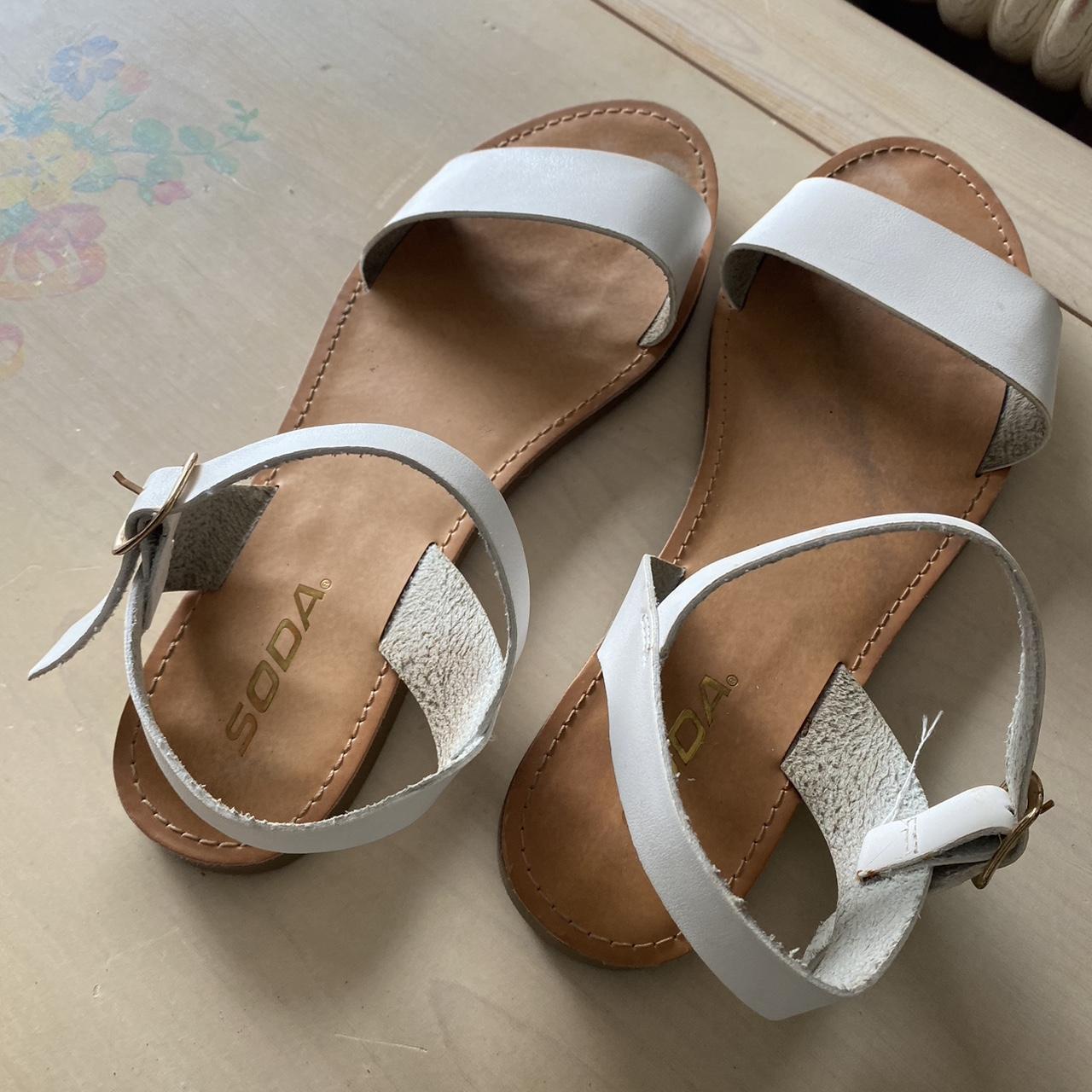 white and tan sandals