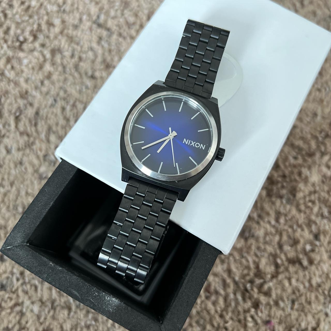 Nixon black stainless steel watch with blue black Depop