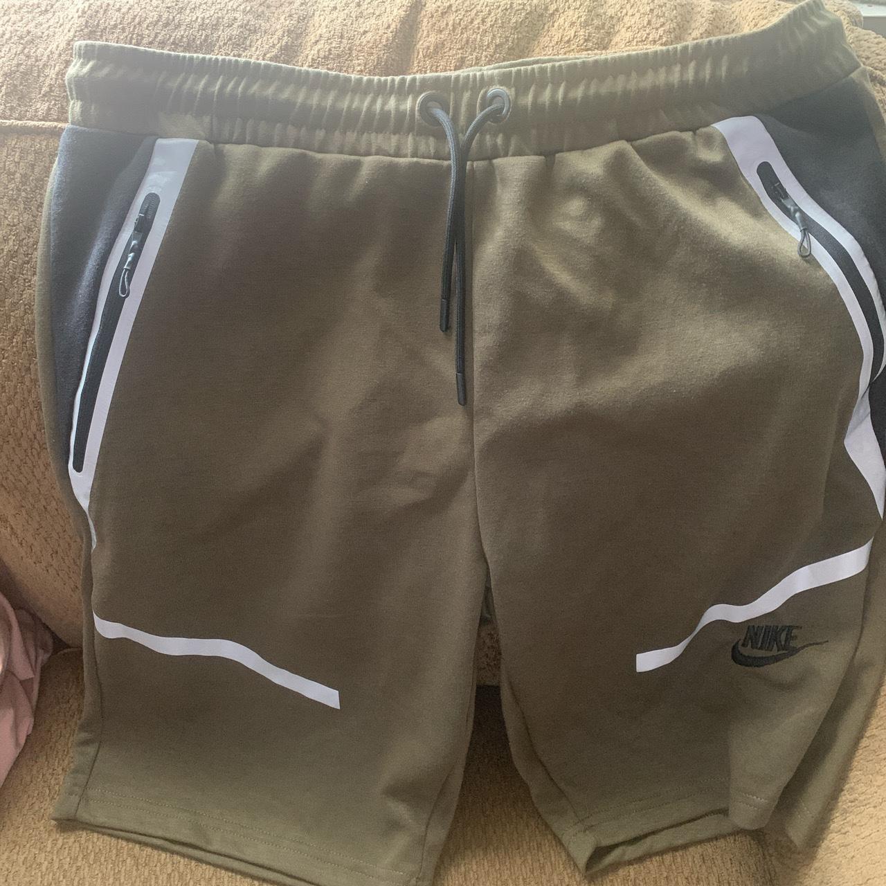 Nike Shorts Has zip up pockets in front and