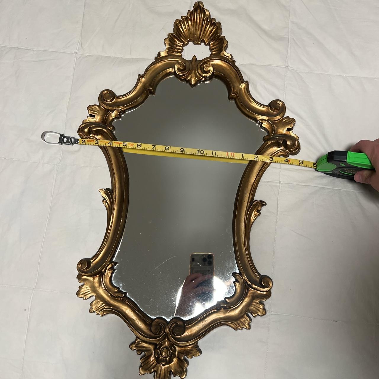 gold frame rococo styled mirror. approximately 2'2