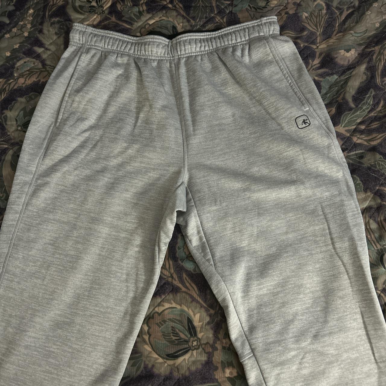 Baggy grey sweatpants with adjustable cuffs and a... - Depop