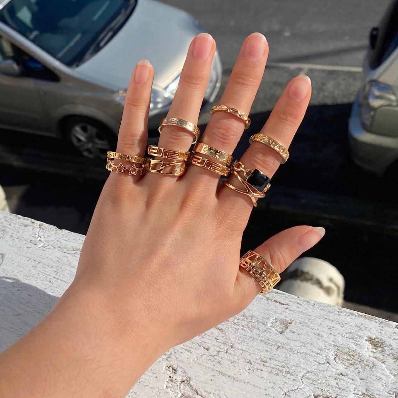Gold cute ring set These ring sizes are... Depop