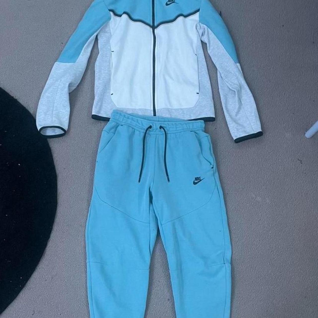 Blue and white nike jumpsuit hotsell