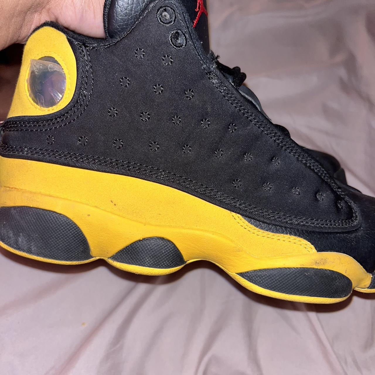 Black and yellow jordan 13 . shown love but still... Depop