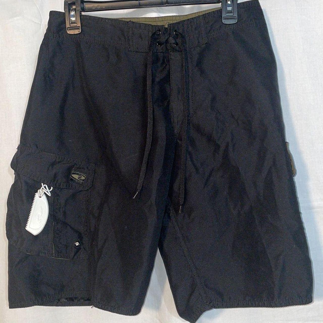 Board shorts with built in wax scraper, size 30, in... Depop