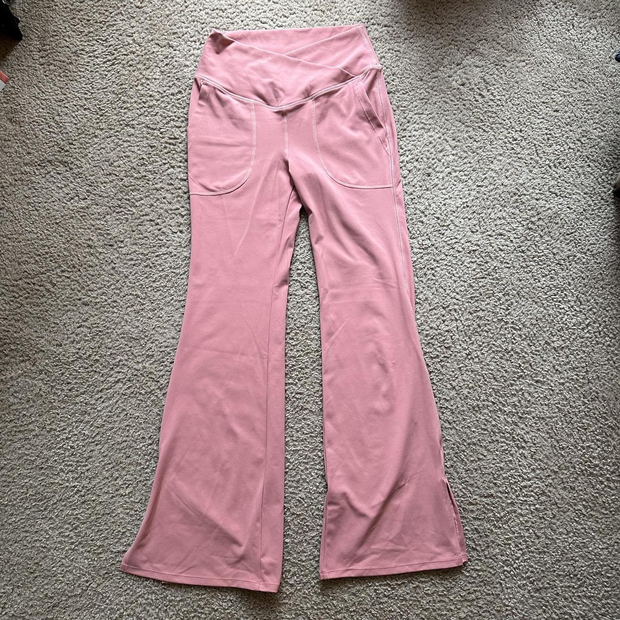 halara pink flared leggings with cross waist band,... - Depop