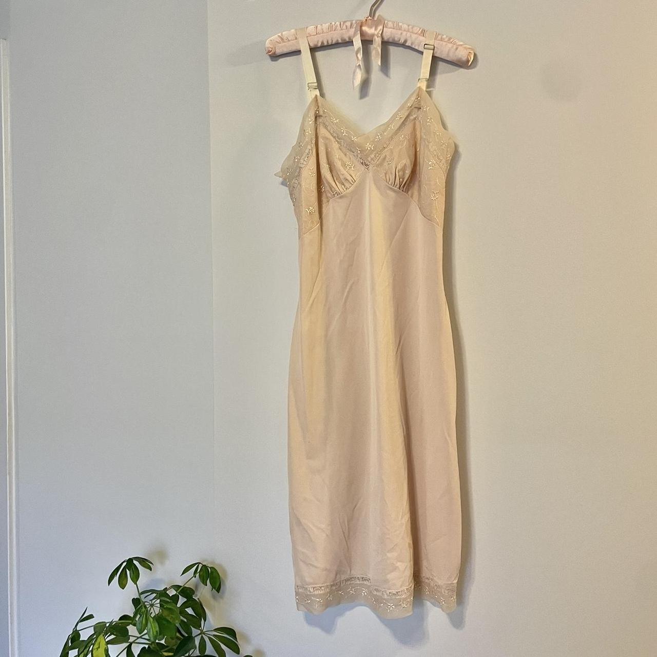 Blush pink slip dress with lace chest design and hem... Depop