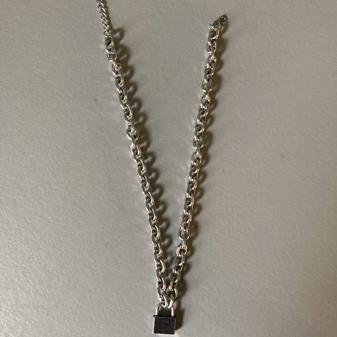 Lock chain. This is a thicker chain with a lock... - Depop