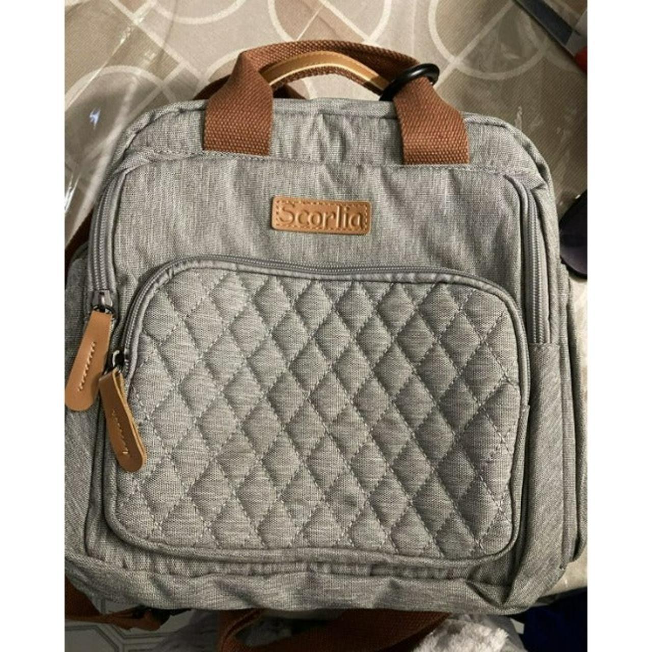 This handbag offers multiple carrying options with - Depop