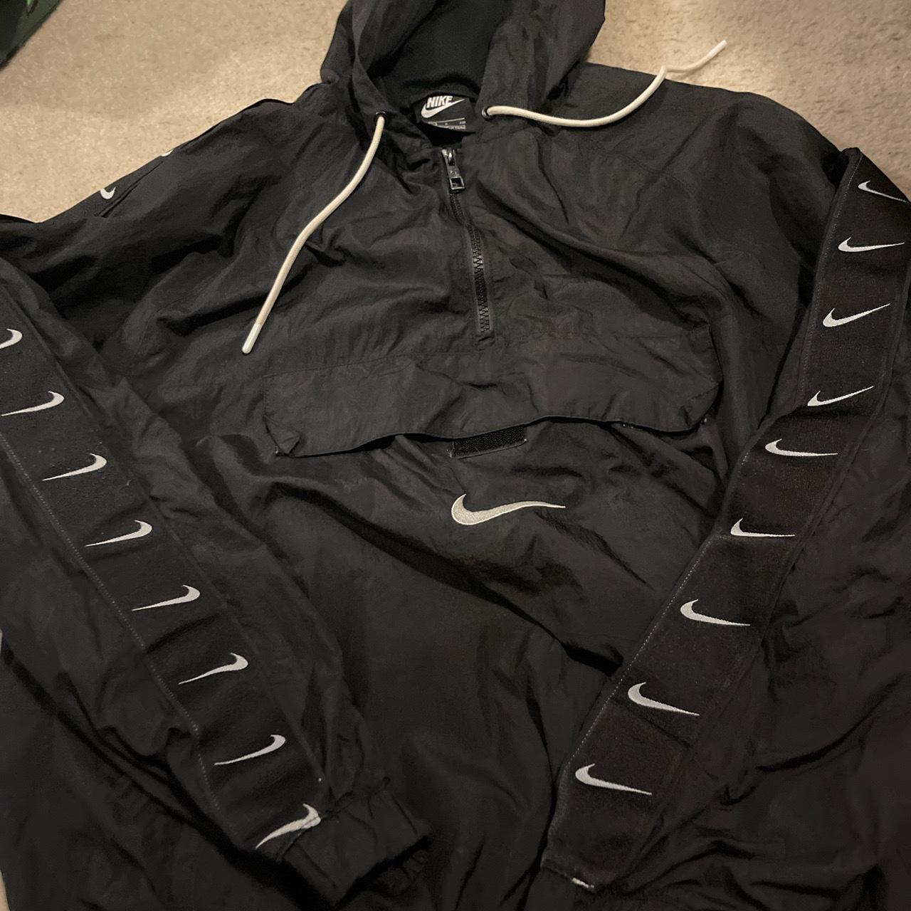 really cool nike windbreaker checks down the sleeve