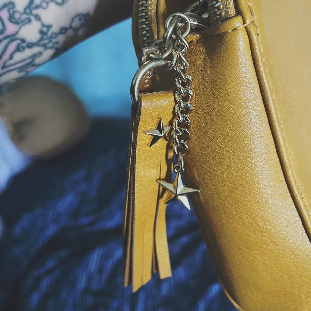 Adorable canary yellow crossbody from Aldo with star