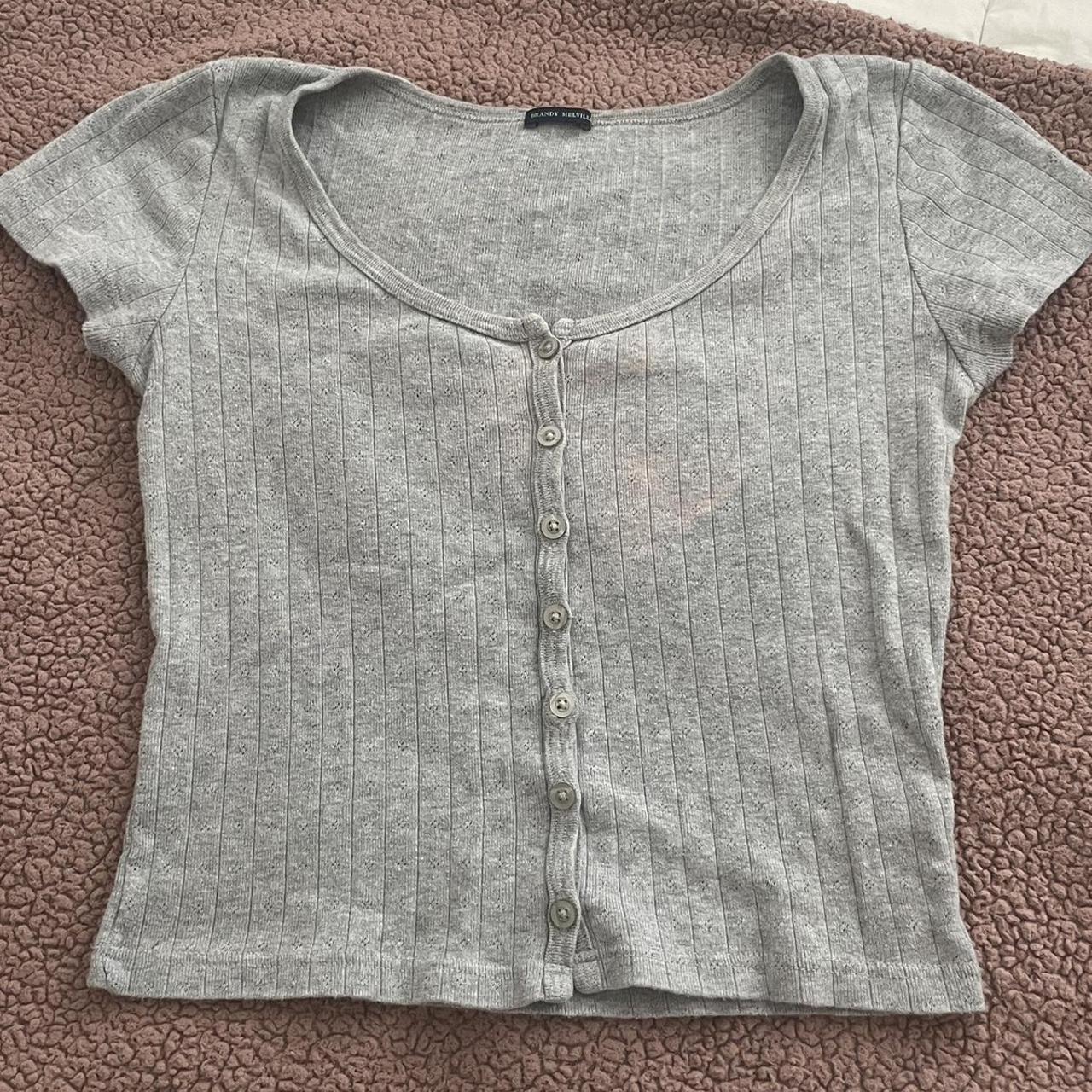 brandy grey flower top! 🩶 has a slight bleach stain... - Depop