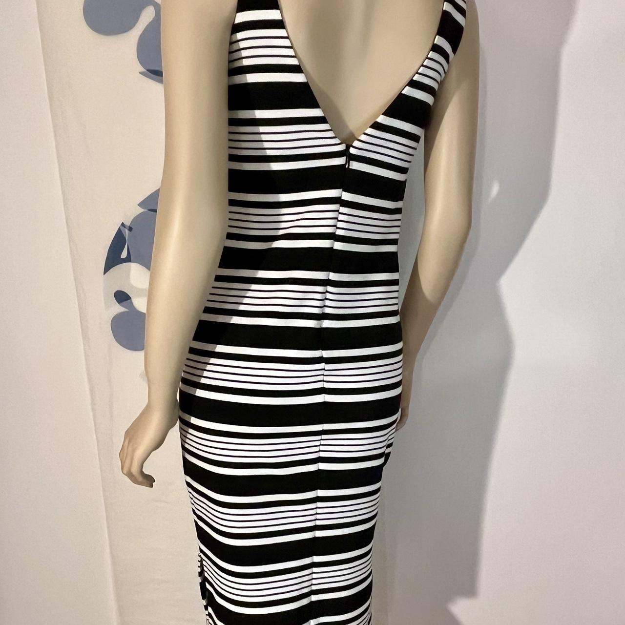 This Betsey Johnson size 0 sheath dress is soft,...