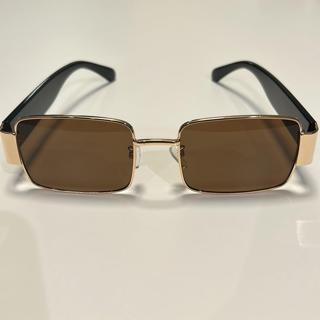 Brand new sunglasses. Black temples, gold rim, brown