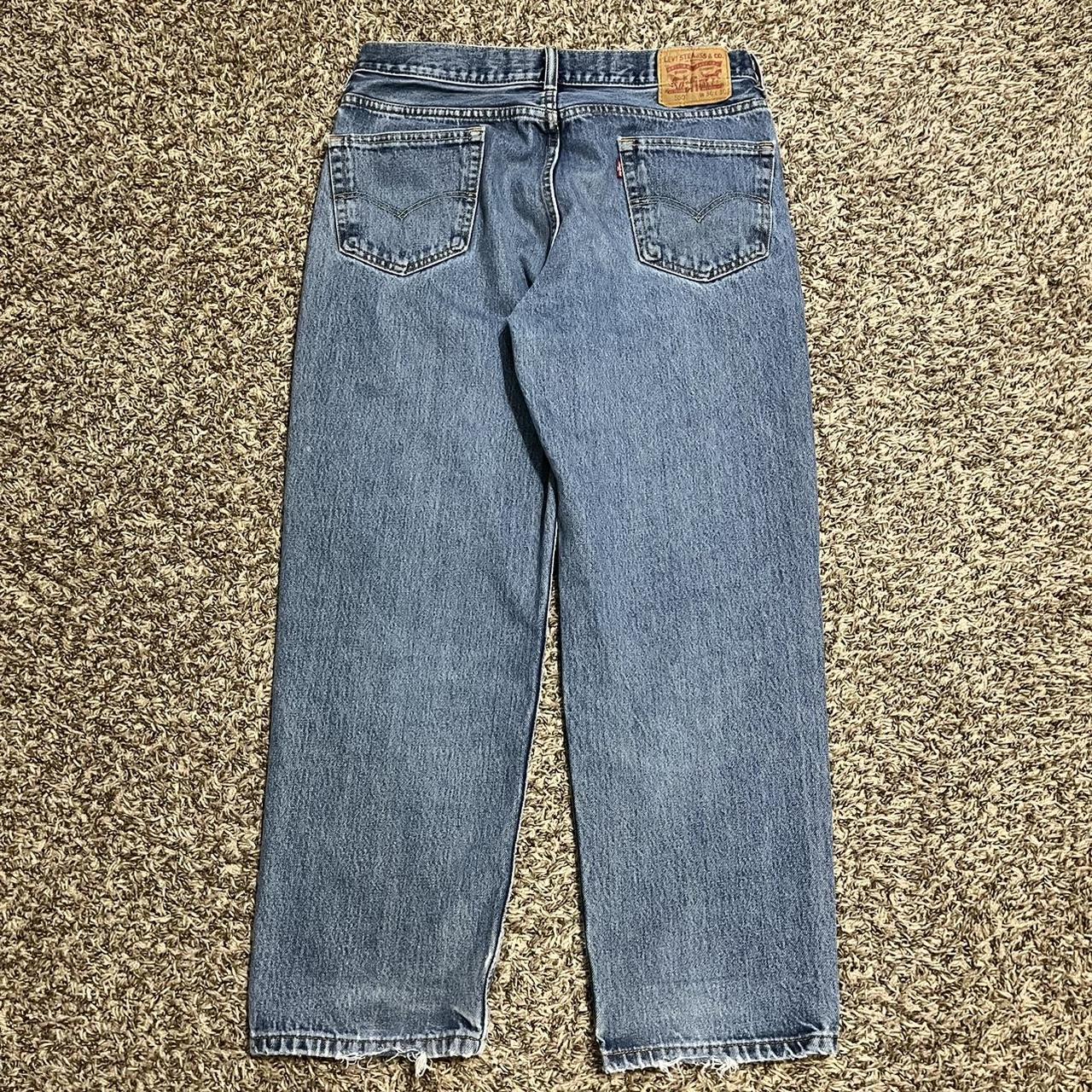 Vintage Levi’s 550 dark blue baggy jeans Size 36,... - Depop