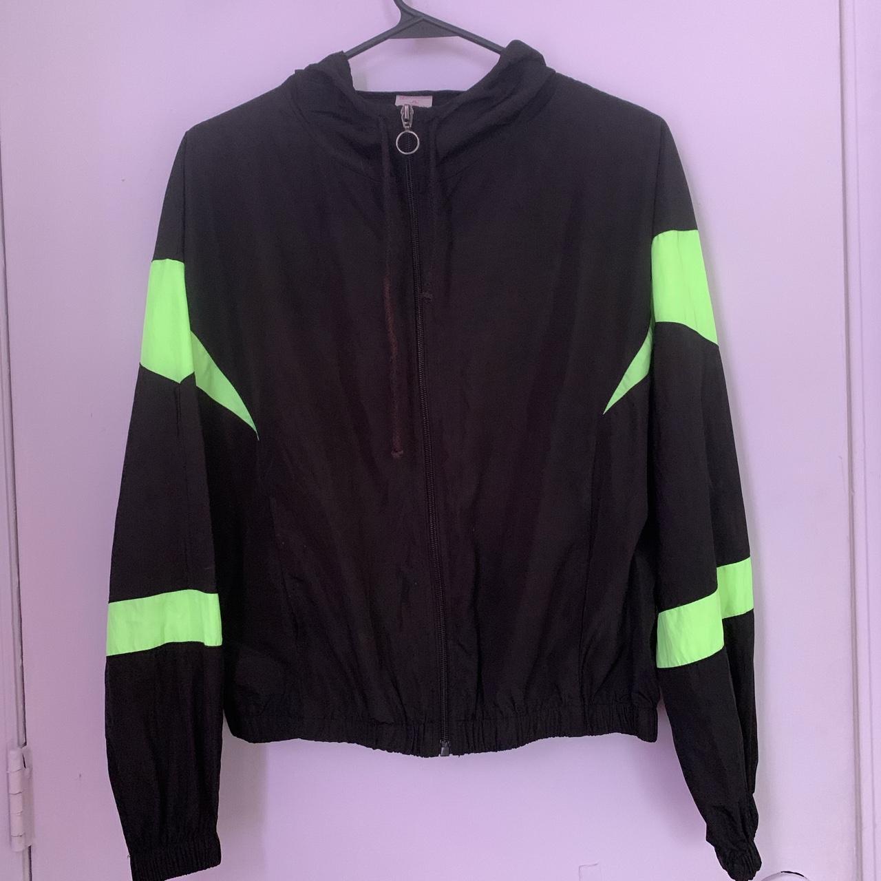 Lime green shop and black windbreaker