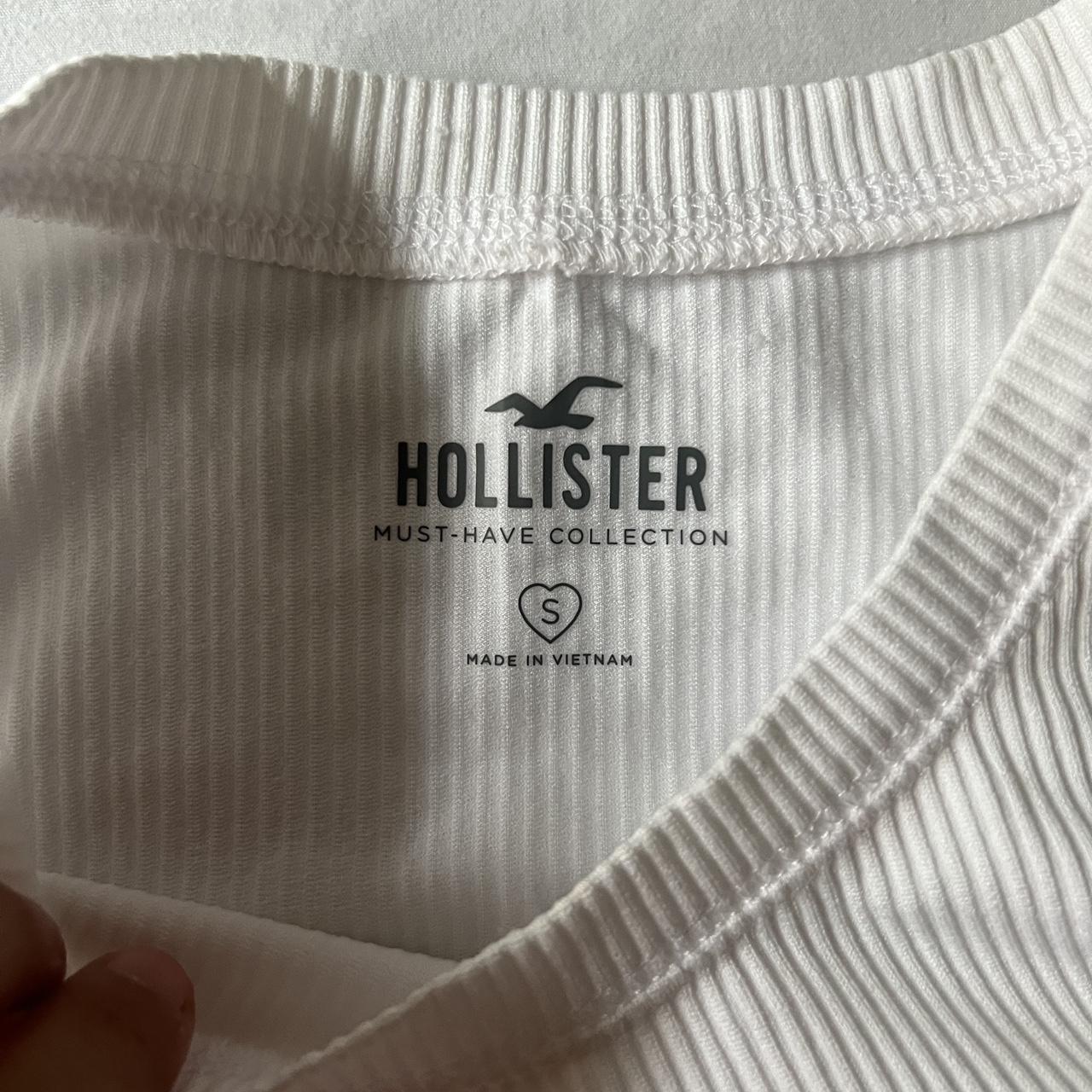 White hollister ribbed tank top ~Size small and is a... - Depop