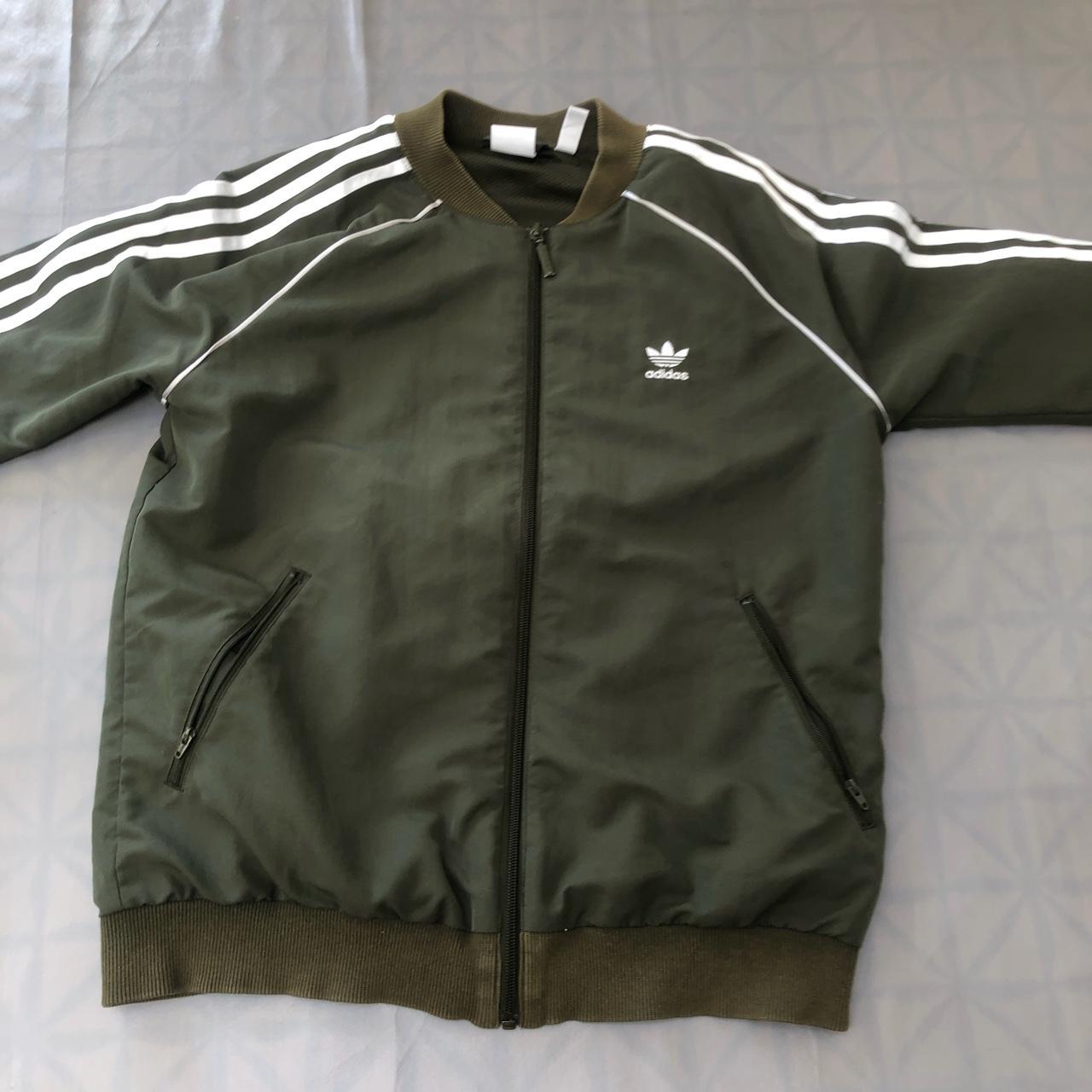 dark green adidas sst track top - Depop