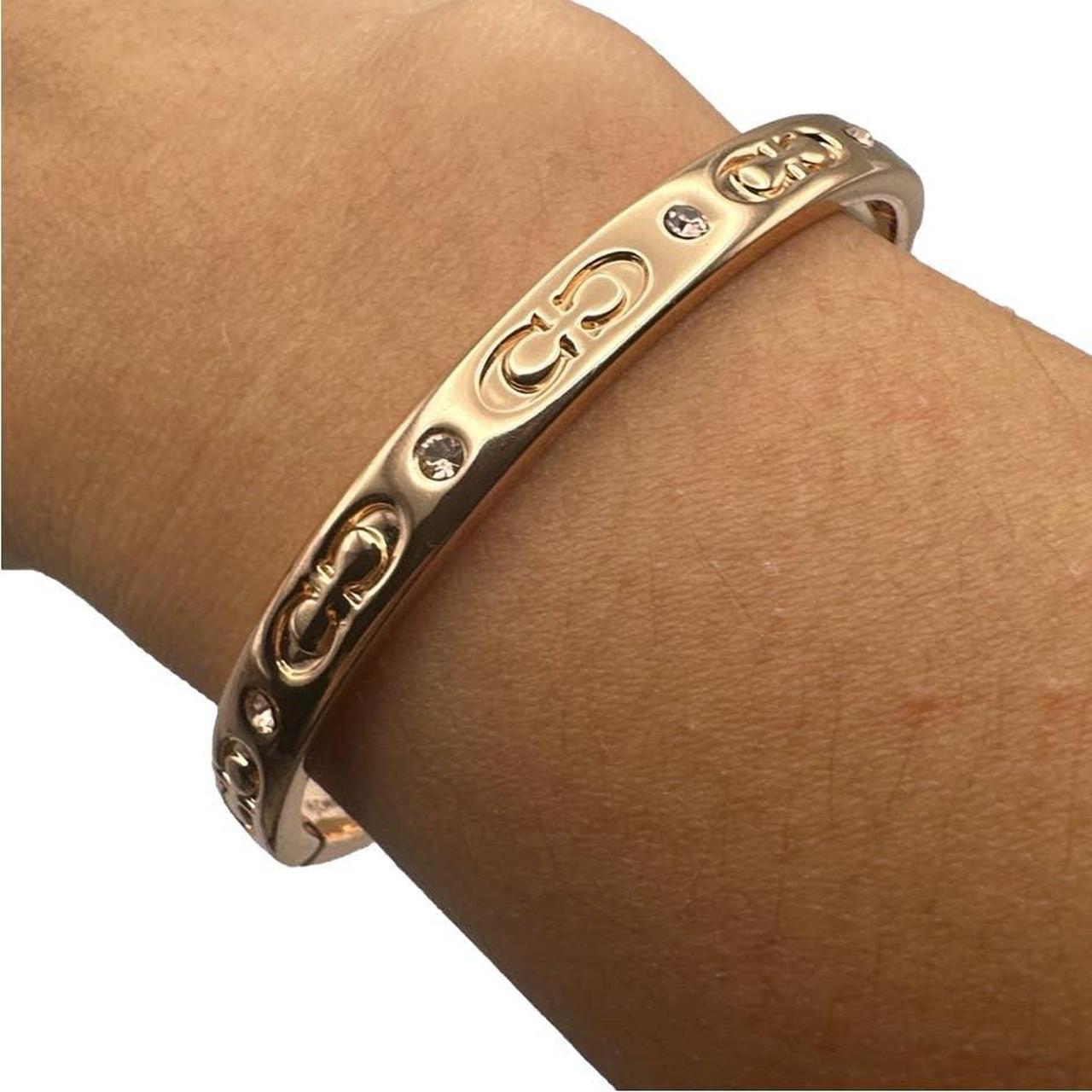 Coach kissing hot sale c bangle