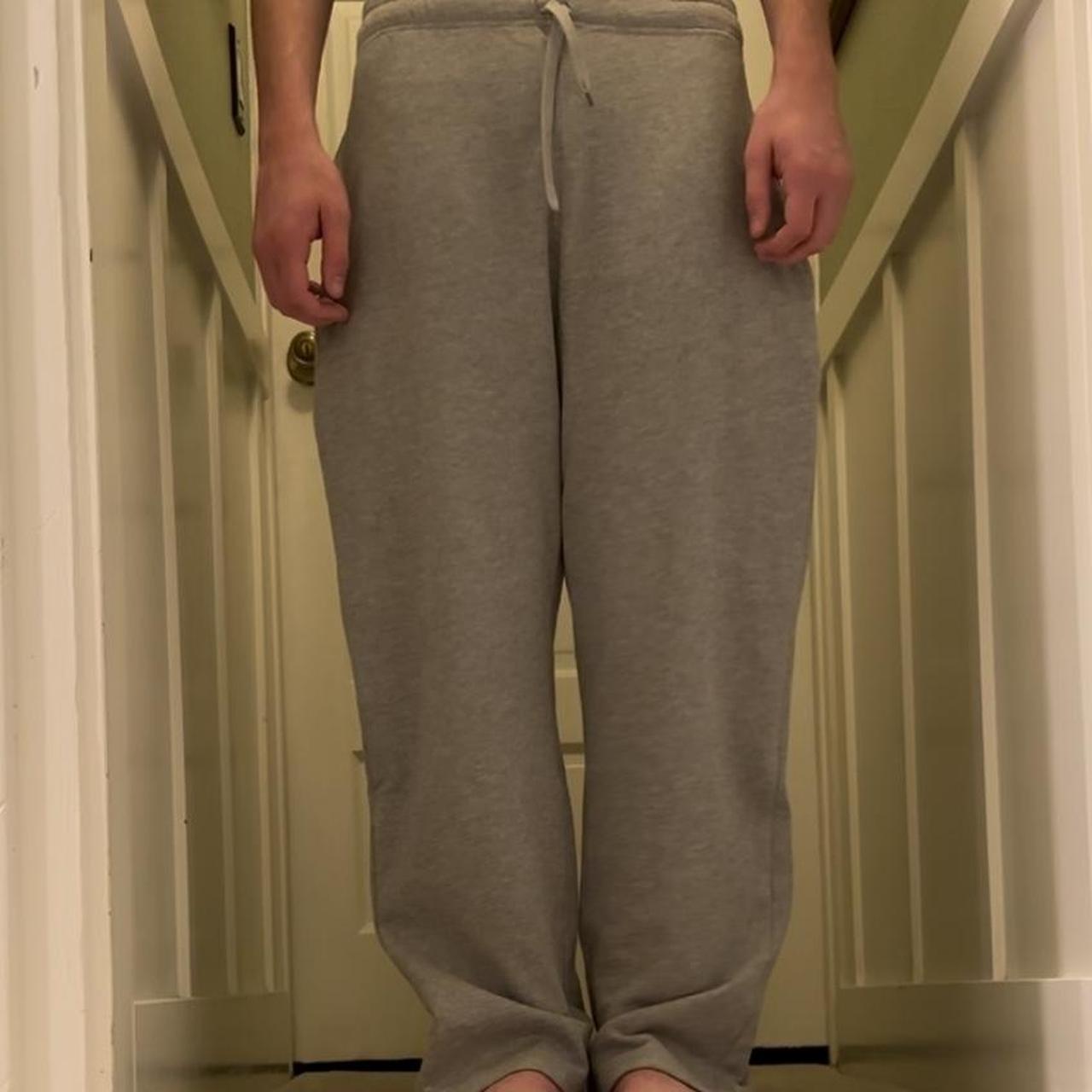 Baggy grey sweatpants, slightly flared Model is... Depop