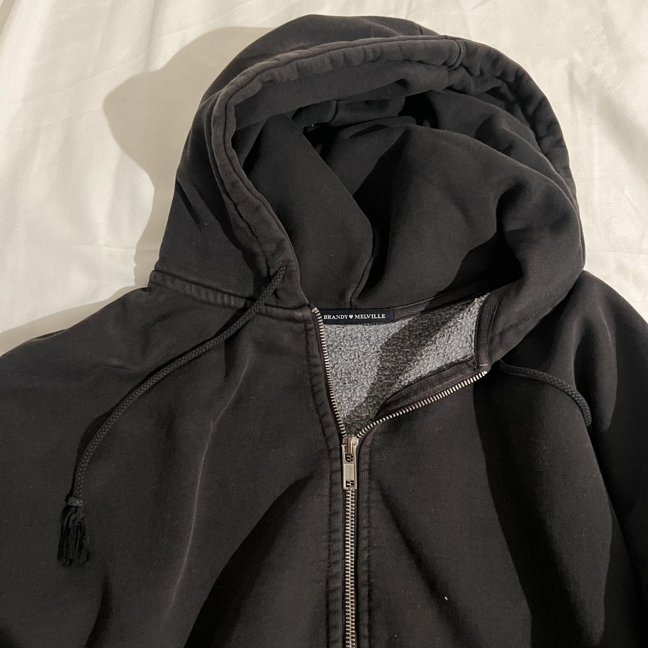 brandy Melville black zip up hoodie got a bit of - Depop