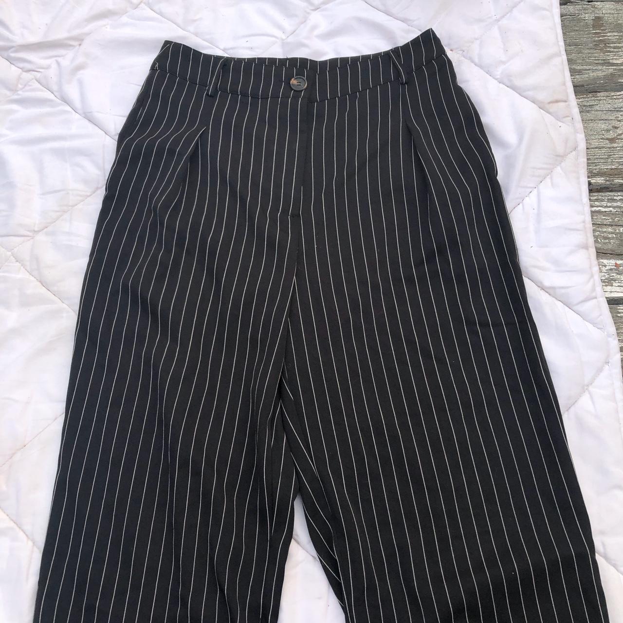 Woman’s pinstripe long black pants Size is large... - Depop