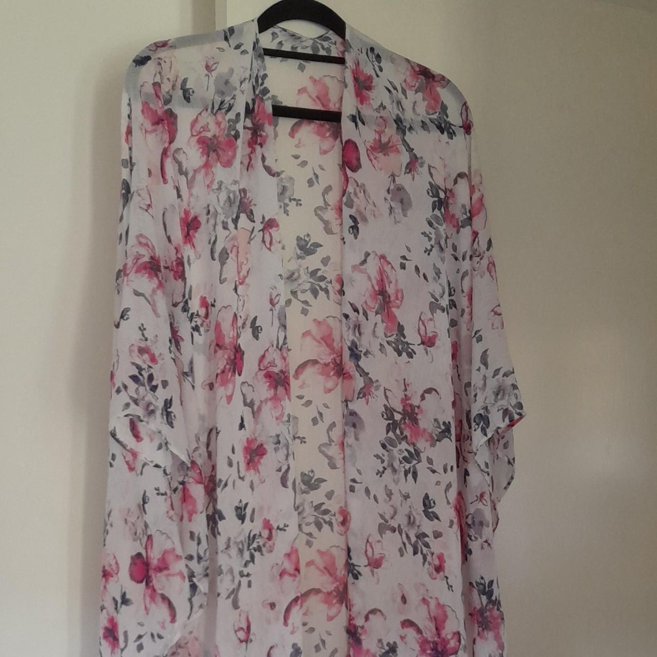 Sheer light beach coverup. White with florals. Holes... - Depop