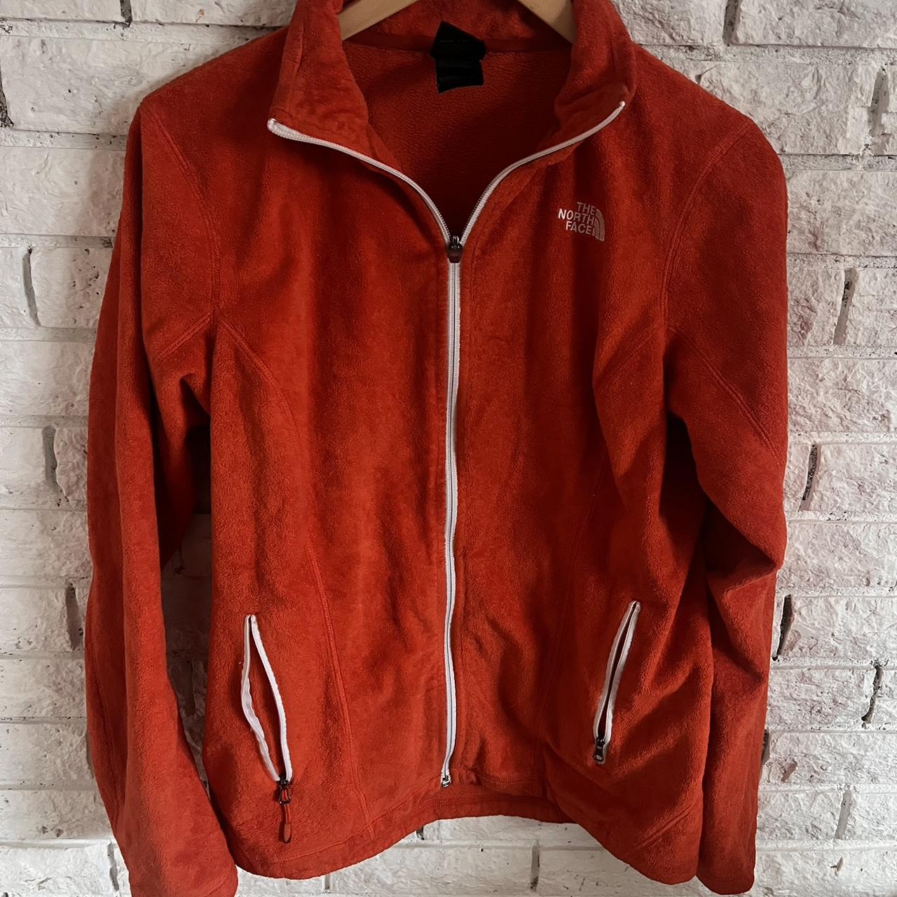 North face store burnt orange jacket