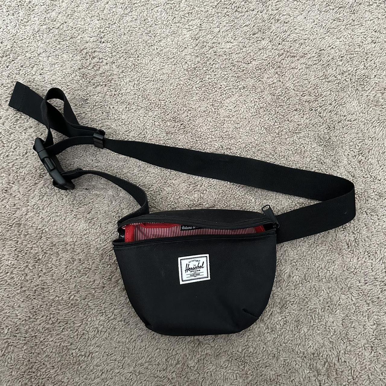 Black Herschel belt bag with red lining. Great... Depop