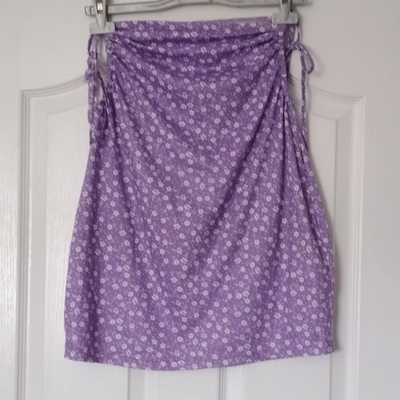 Purple skirt with small white flowers and string... - Depop