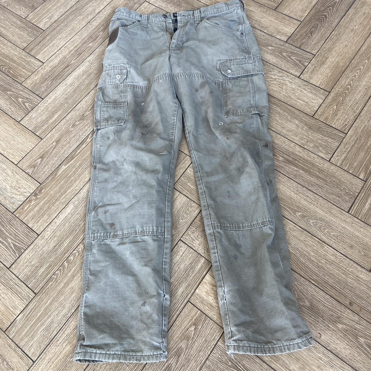 Heavily distressed wrangler cargos. Back pocket has... - Depop