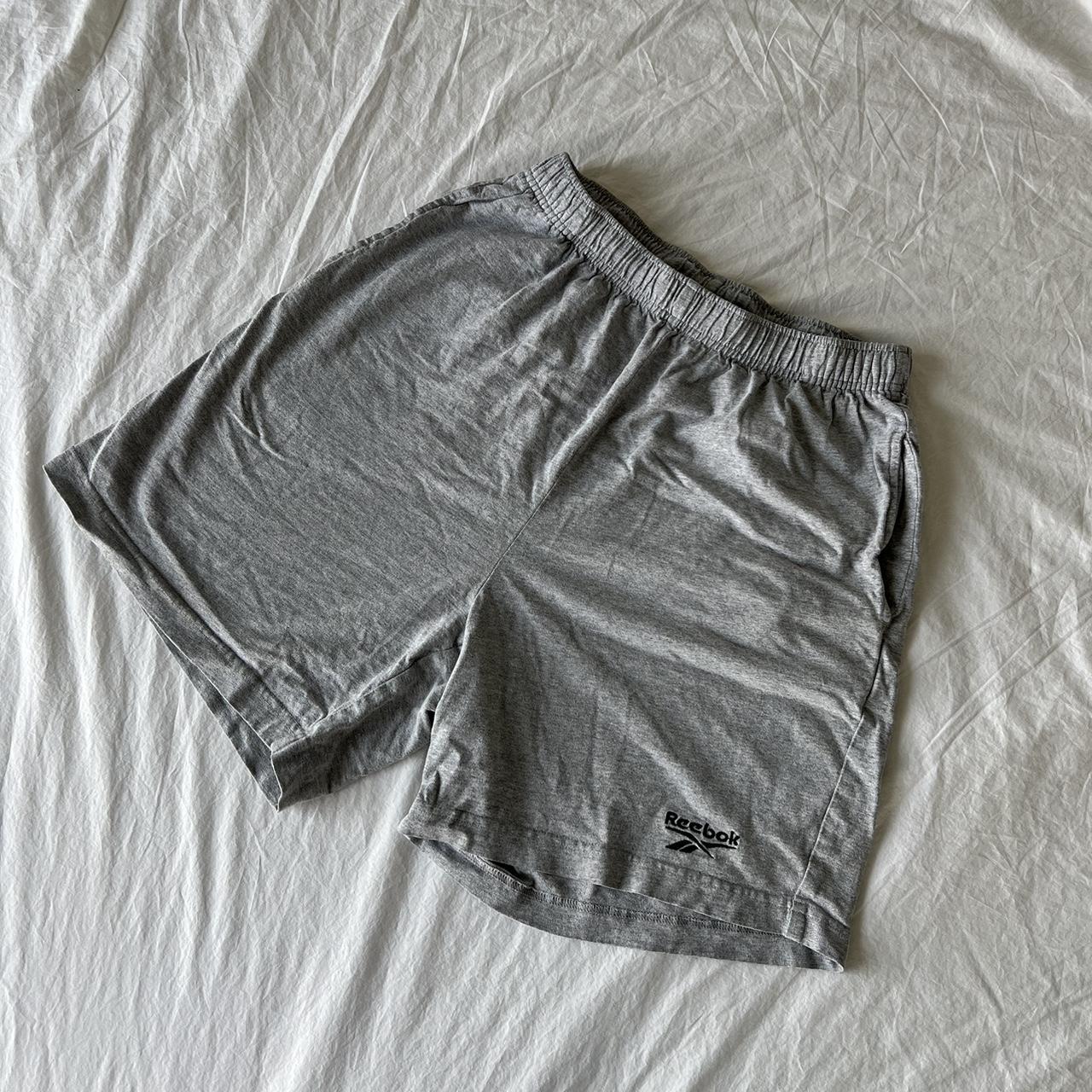 Vintage Reebok cotton shorts #band #depop #graphic... - Depop