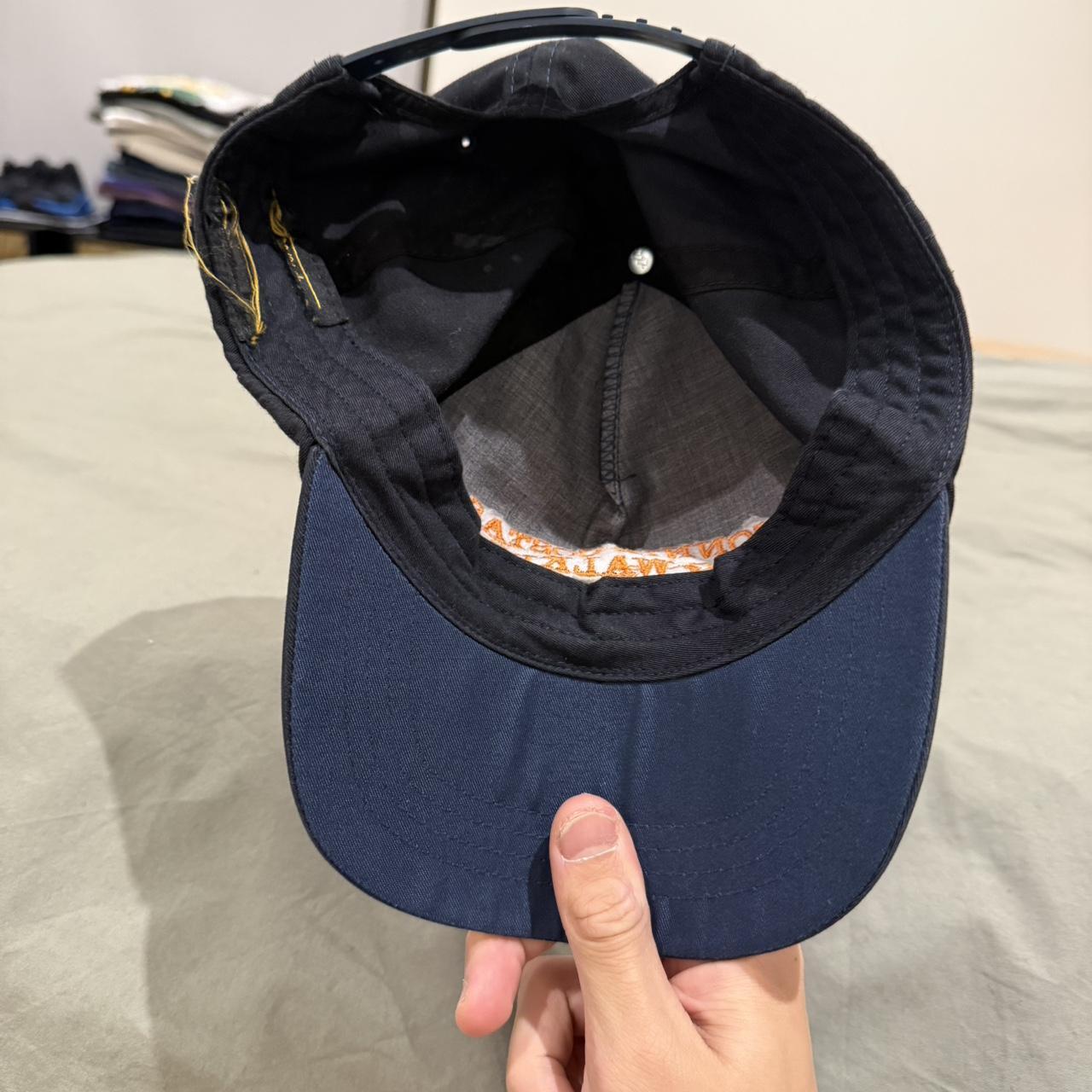 Black and orange Connie Costas dog walking service hat | Depop