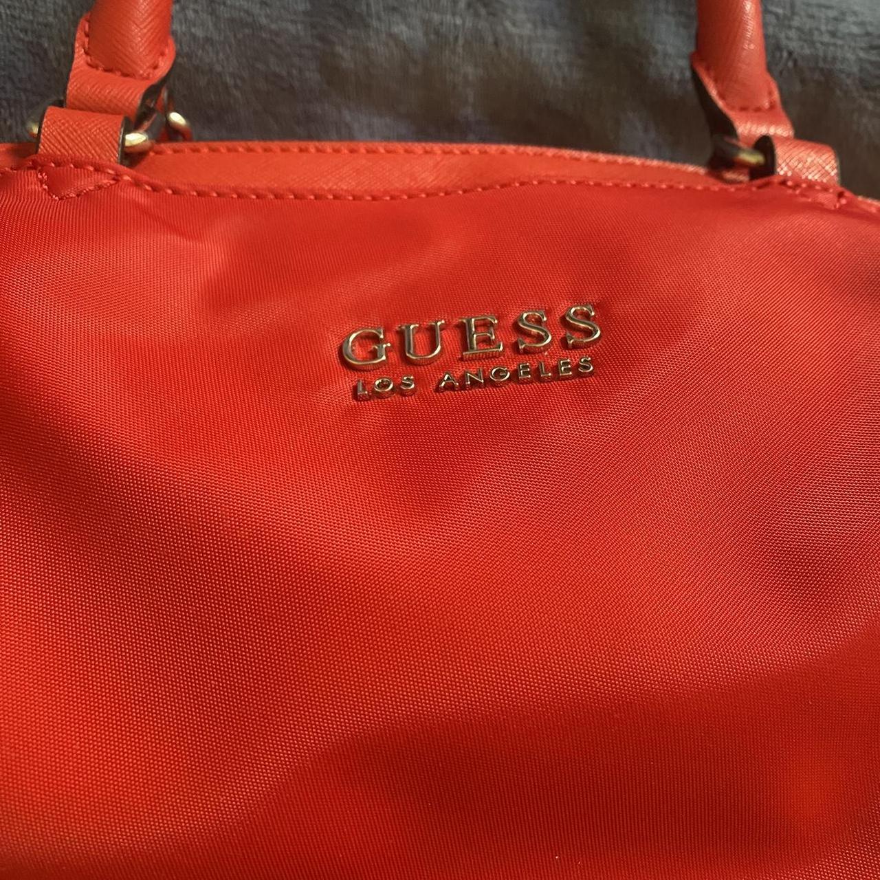 Red Guess Luxe bag, red with gold studs and tassel, - Depop