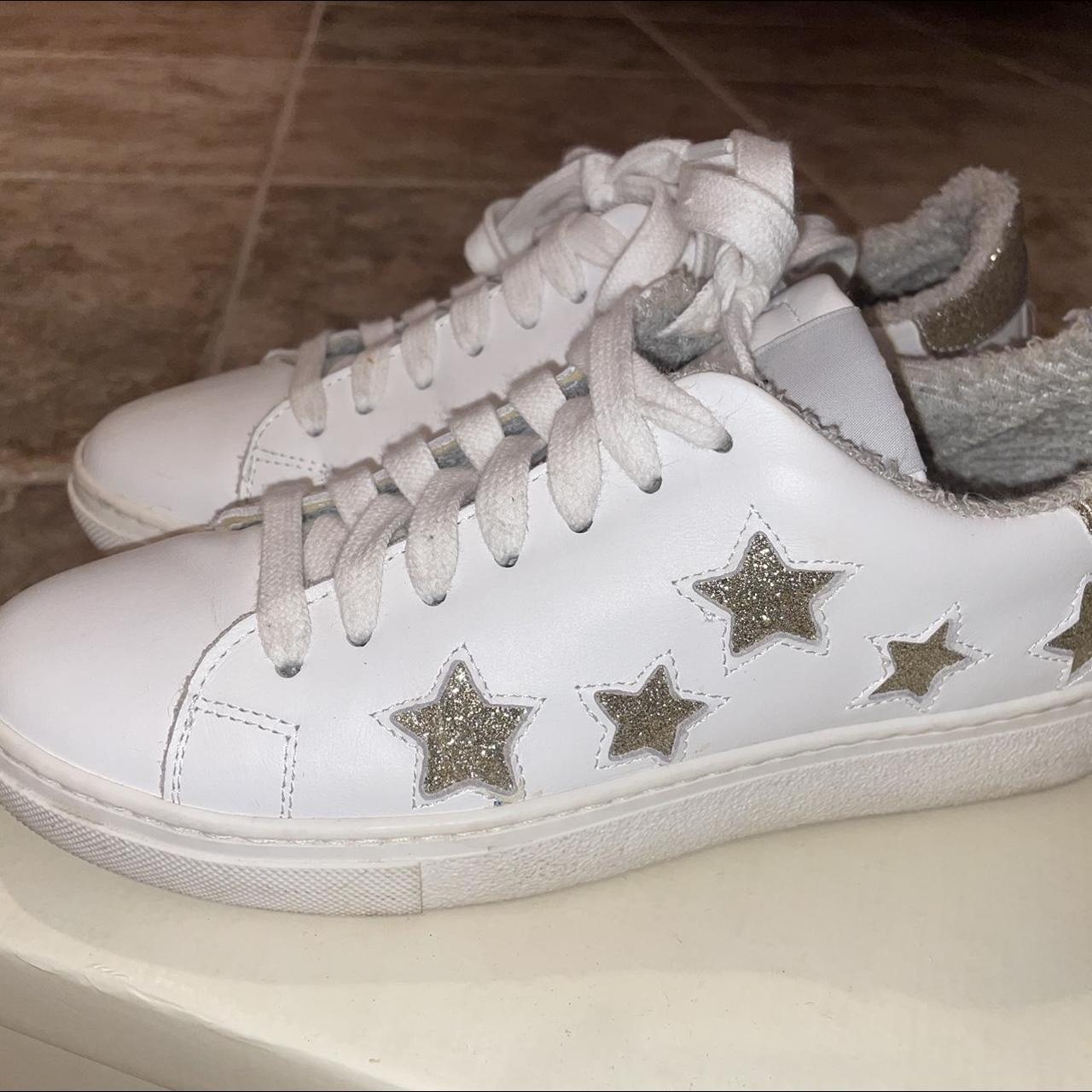 White trainers with fashion stars