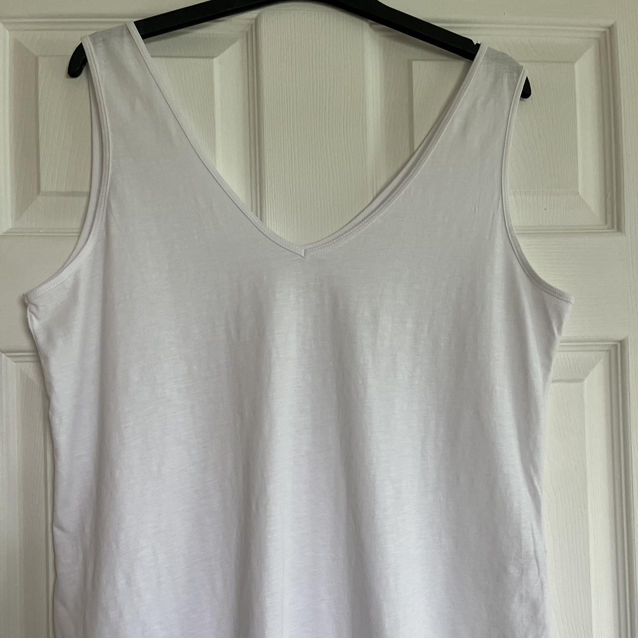 Black and white cotton vest tops from