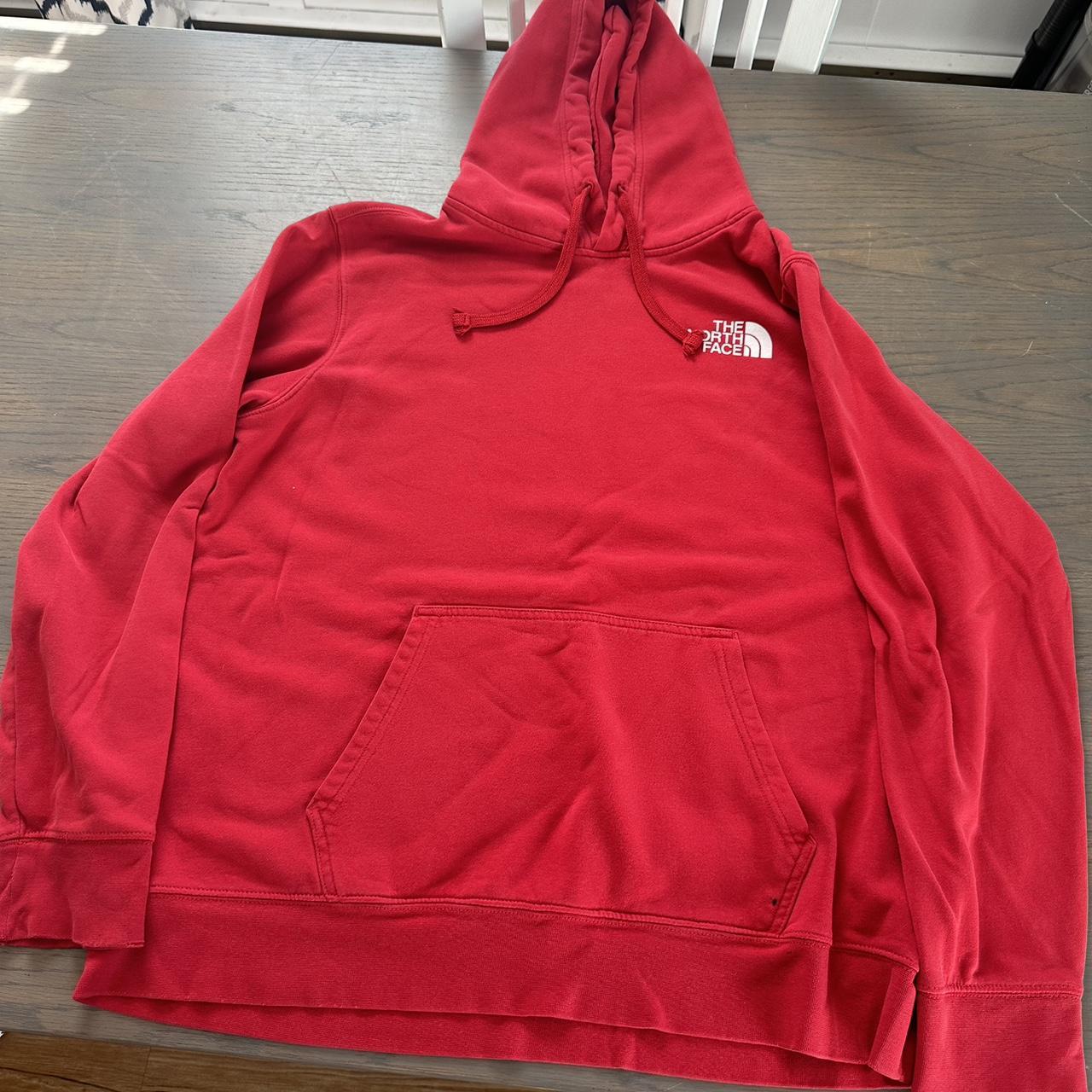Red north face hoodie Sleeves have some tears at the... Depop