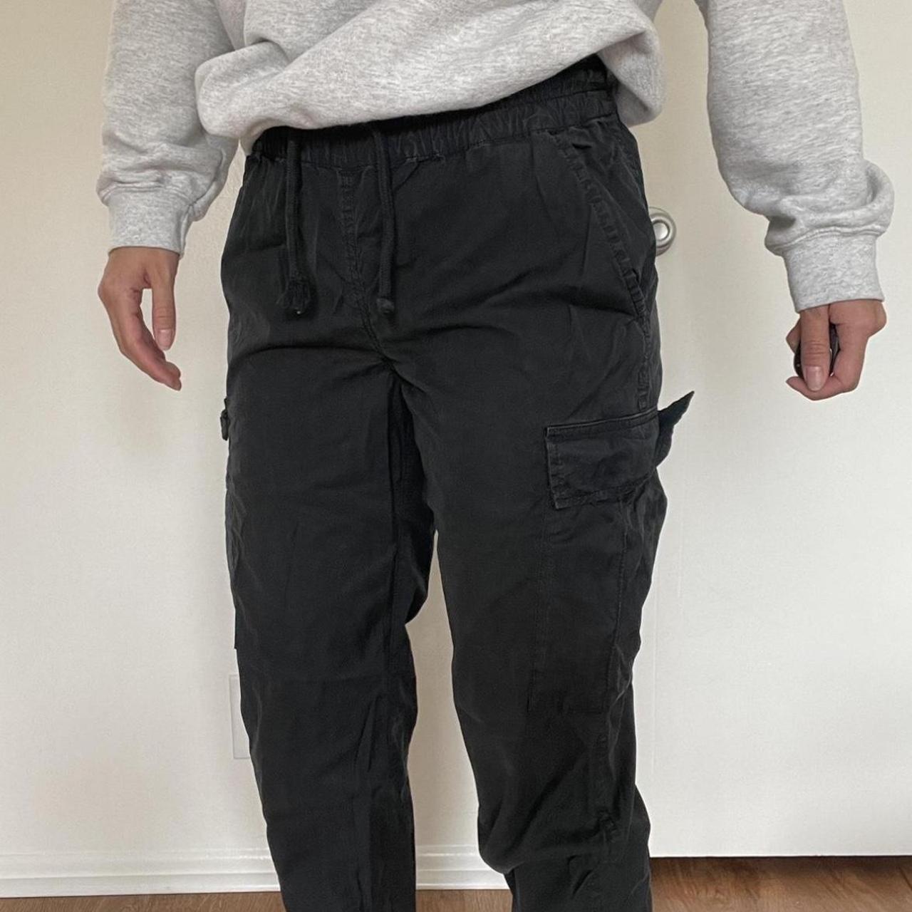 Aritzia/TNA charcoal grey cargo pants. Tapered at... Depop