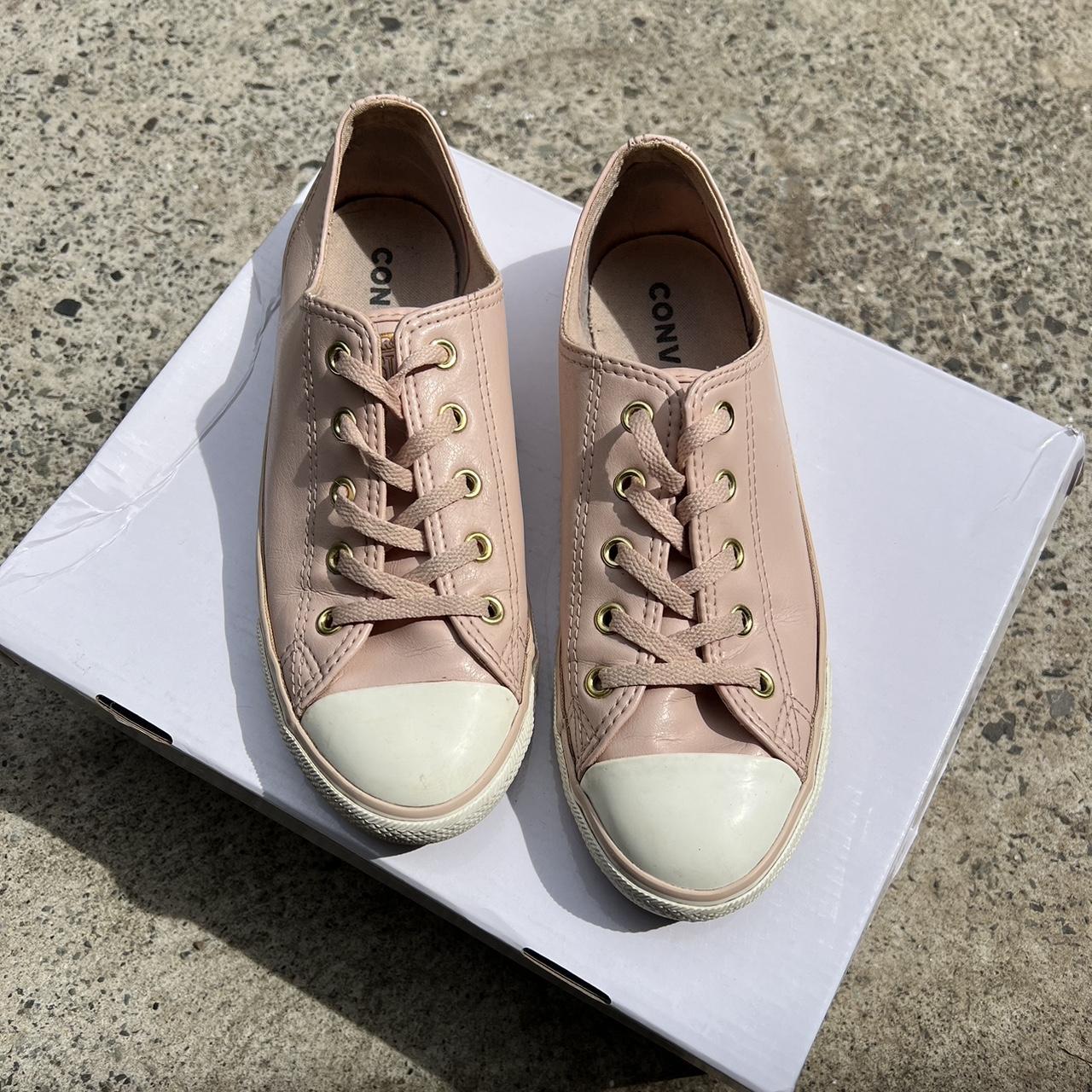 Dusty pink Converse All Stars with gold eyelets. AU