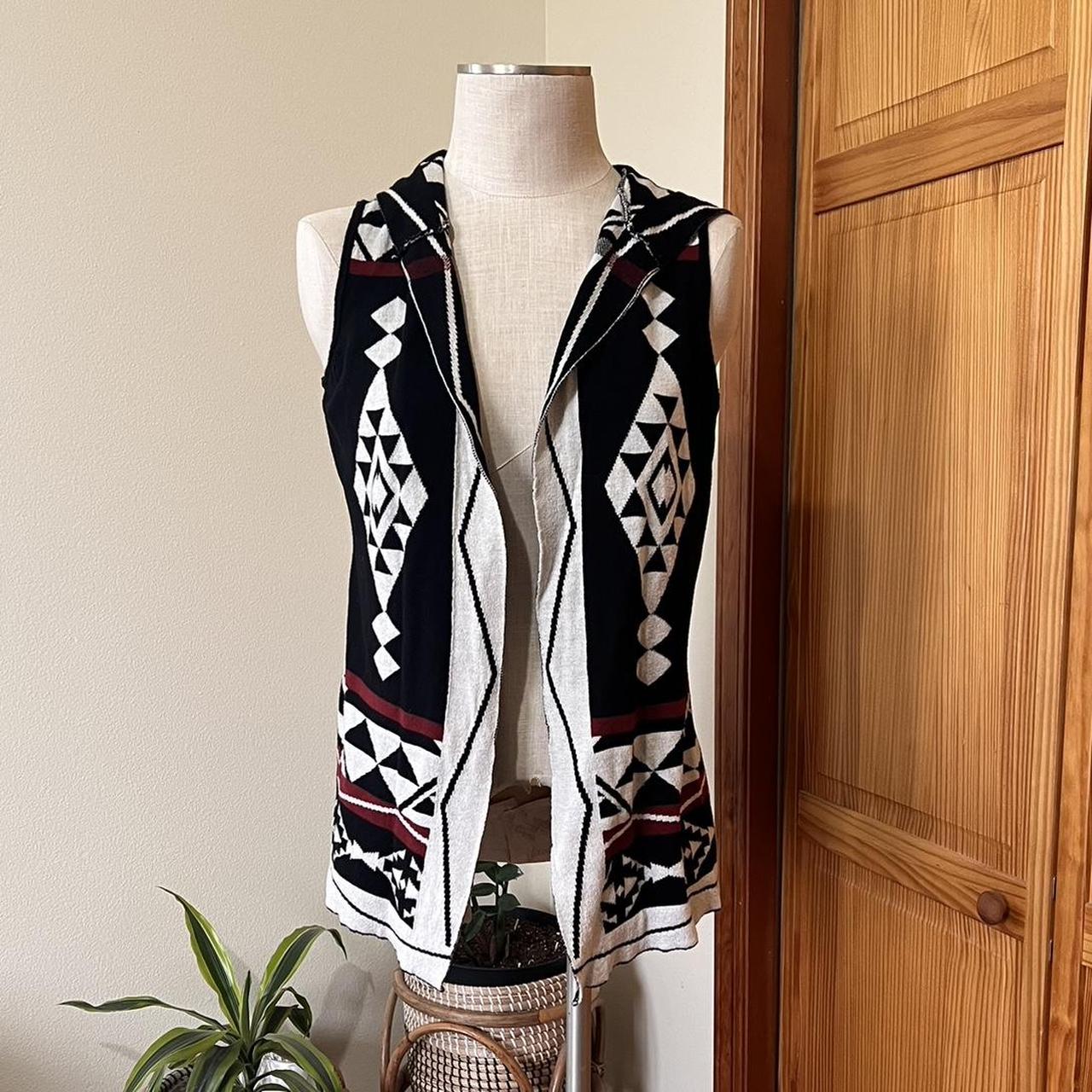 This medium sized sleeveless hooded cardigan vest by Depop