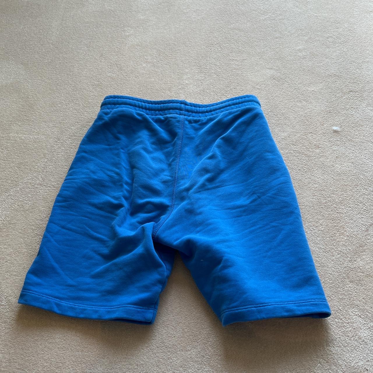 Blue off white shorts barely worn size 12 kids - Depop