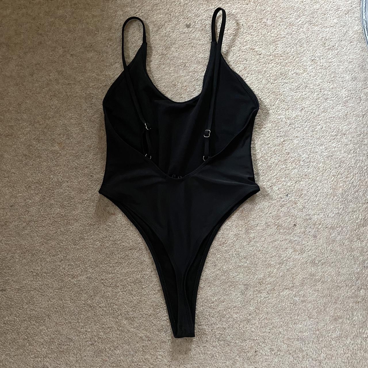 Missguided black high leg scoop back swimsuit. Size... Depop