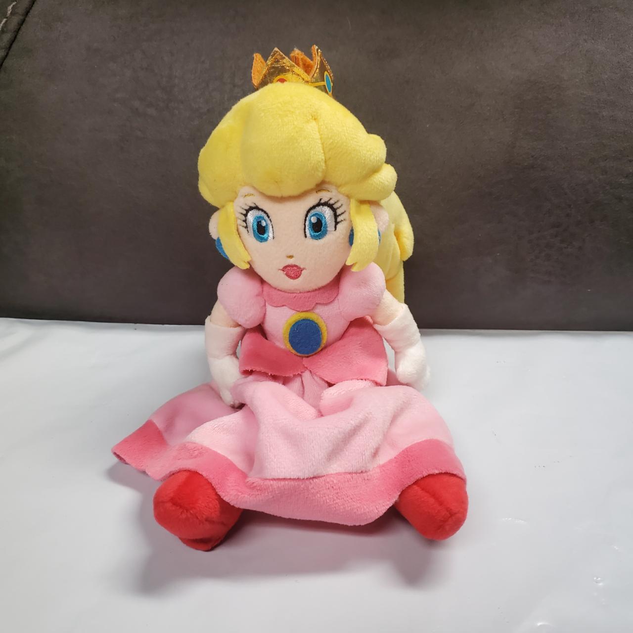 This is a 9-inch Princess Peach plush toy made by... - Depop